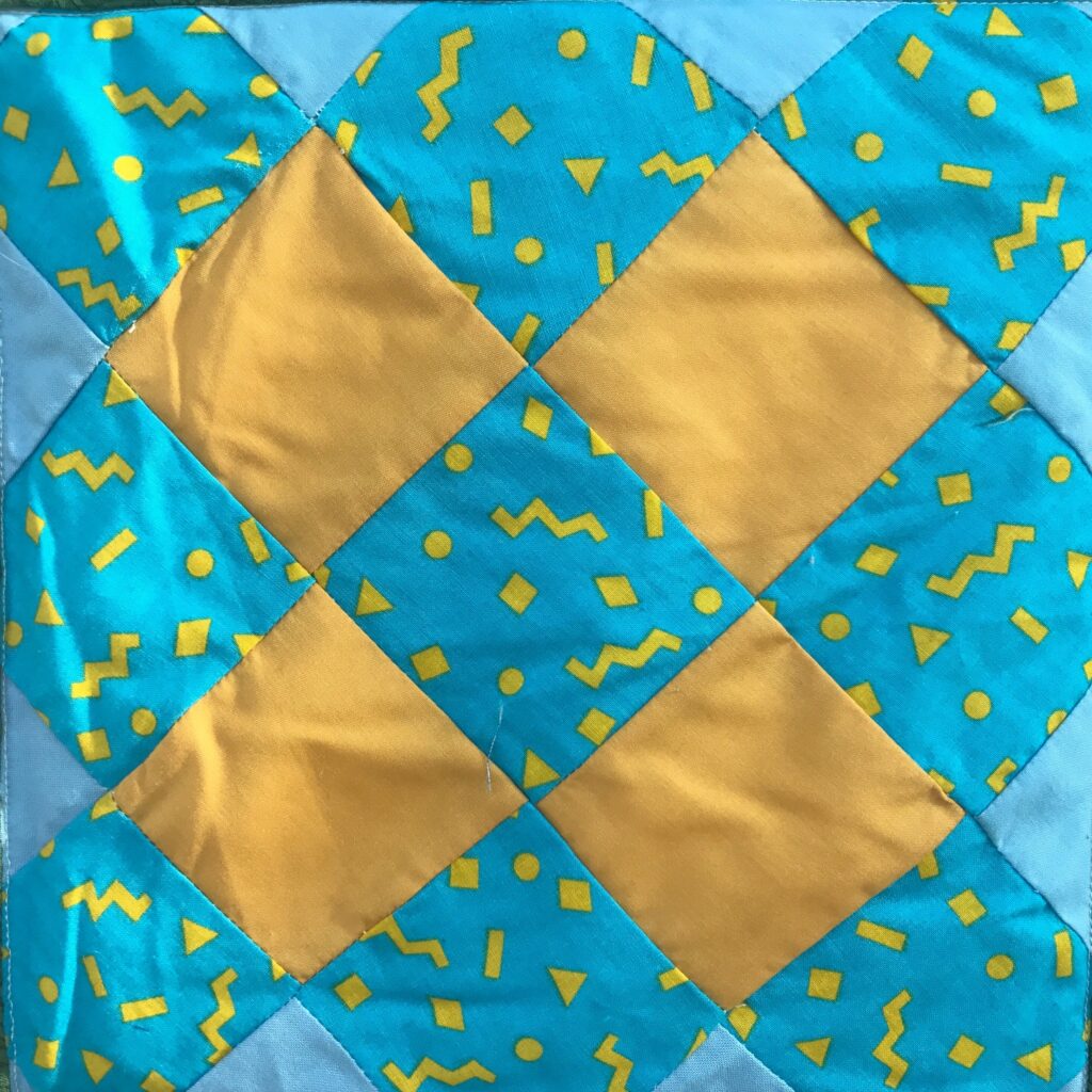 A blue and yellow quilted pattern