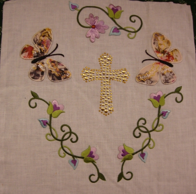 Lois Busch/Hitchcock, A beautifully embroidered floral design around a cross