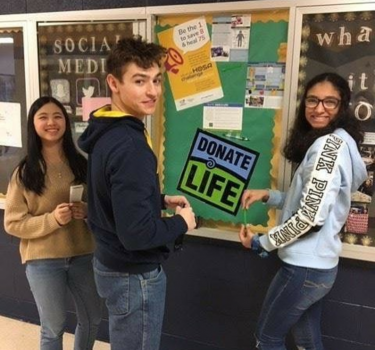 students with billboard display