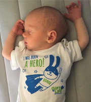 Coleton Voss, Michigan's first placenta donor, wearing his Gift of Life onesie to show he started life as a hero