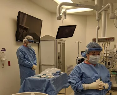 The team observes a moment of silence prior to recovering tissue from a donor. 