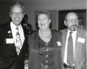 black/white photo with two men and a woman