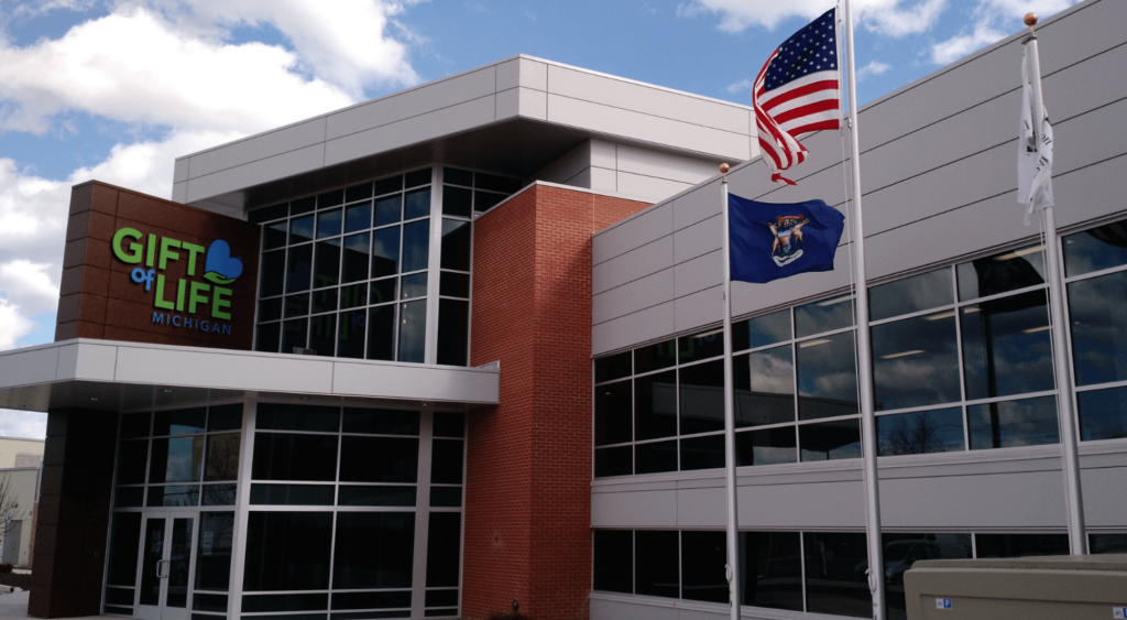 Gift of Life building with American and Michigan flags flying