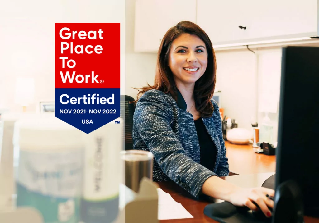 woman at computer with Great Place to Work banner