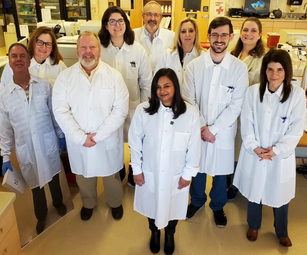 Group of laboratory staff in white coats