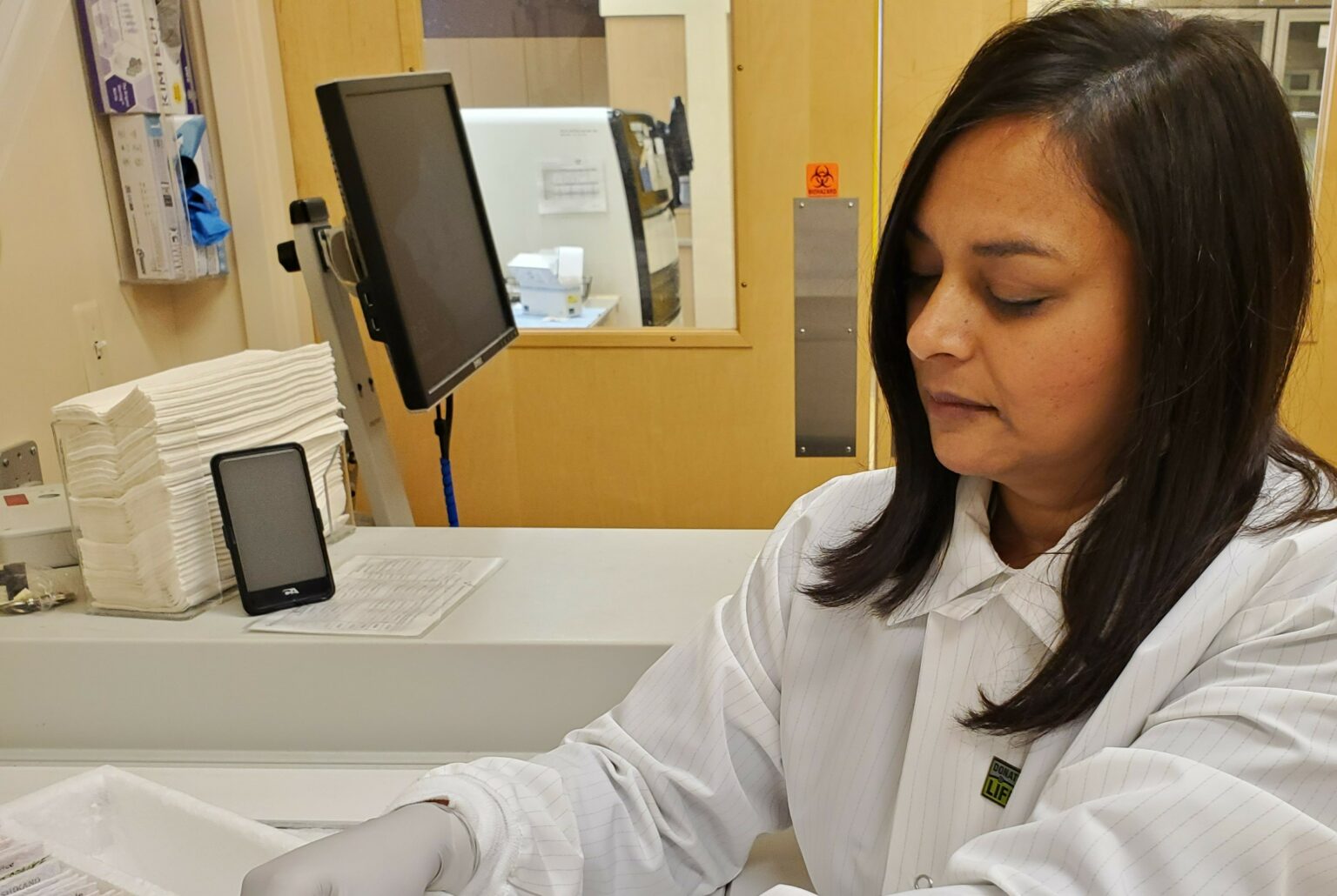 Nilam with blood samples in the lab - cropped