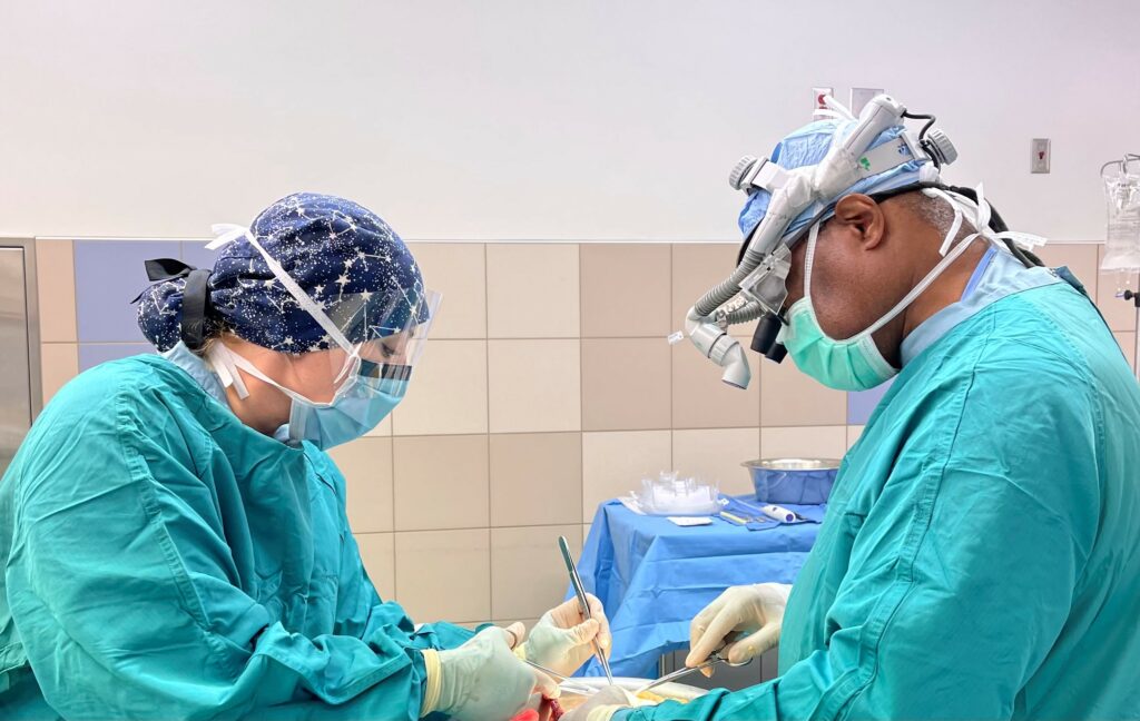 Tissue recovery technicians in the operating room, holding surgical instruments