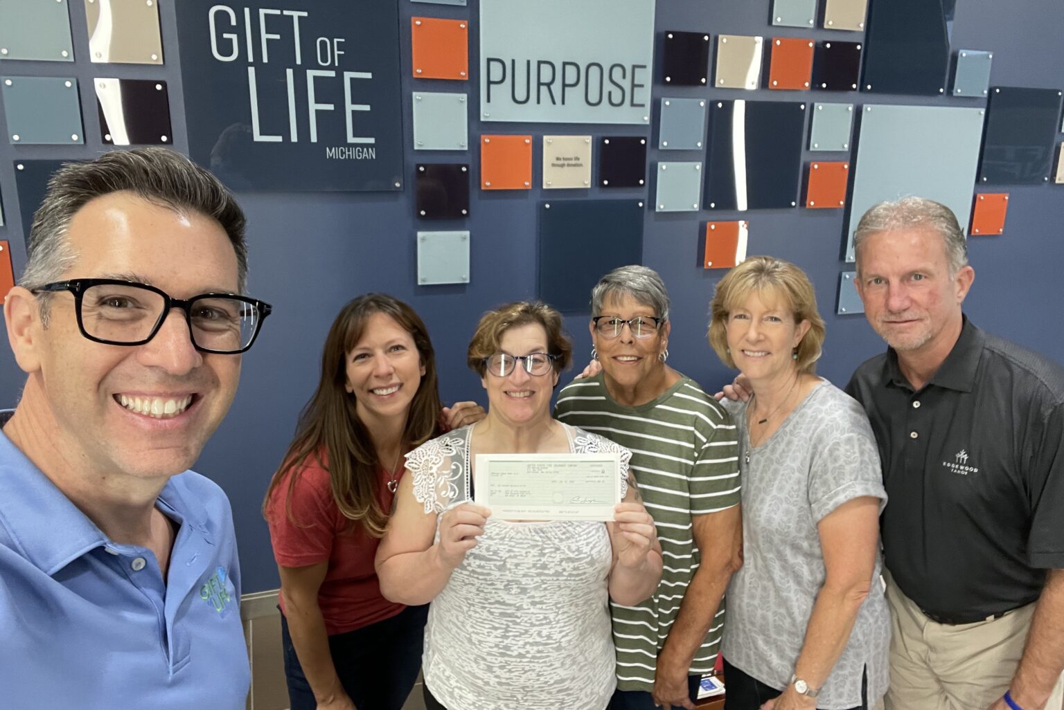 At the check presentation at Gift of Life Michigan was (left to right): Patrick Wells-O’Brien, VP, Communications and External Relations; Lisa Galas, Julia Evans’ mother; Sandy Checkal; Marge Del Greco, Gift of Life Foundation Board Member; Renee and Rick VanderHagen, Crum and Forester.