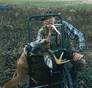 hunter with a large buck he shot