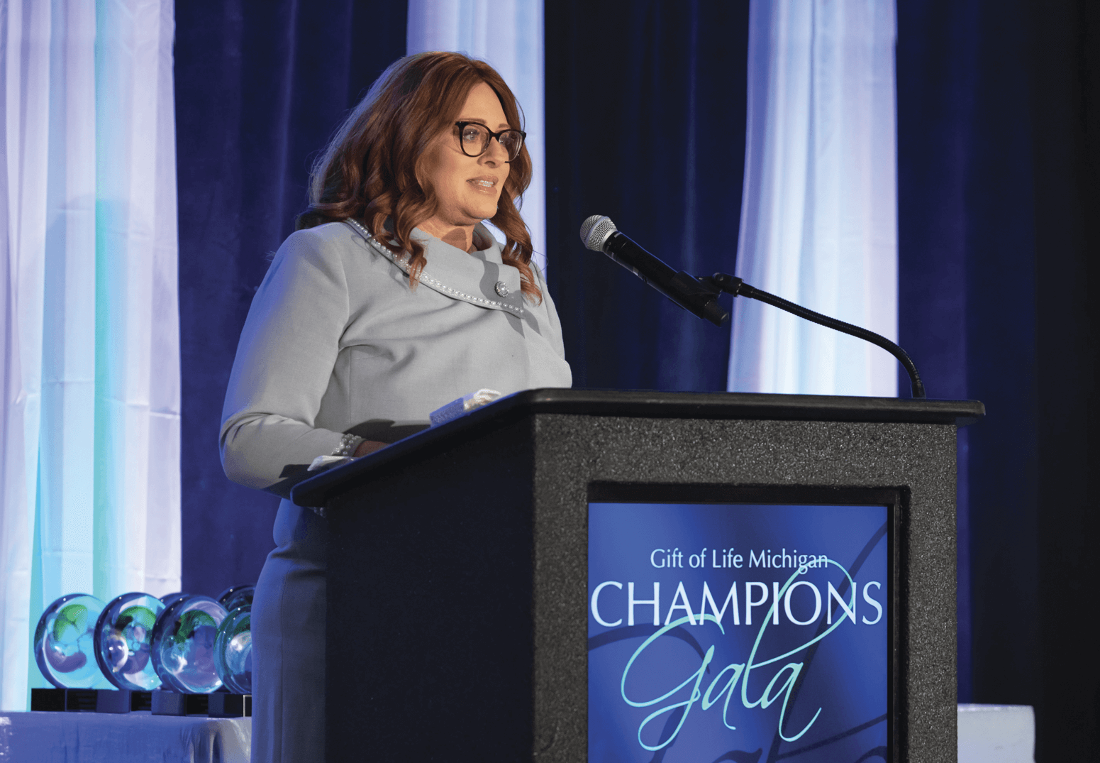 Gift of Life President and CEO Dorrie Dils at the podium during a Champions Gala