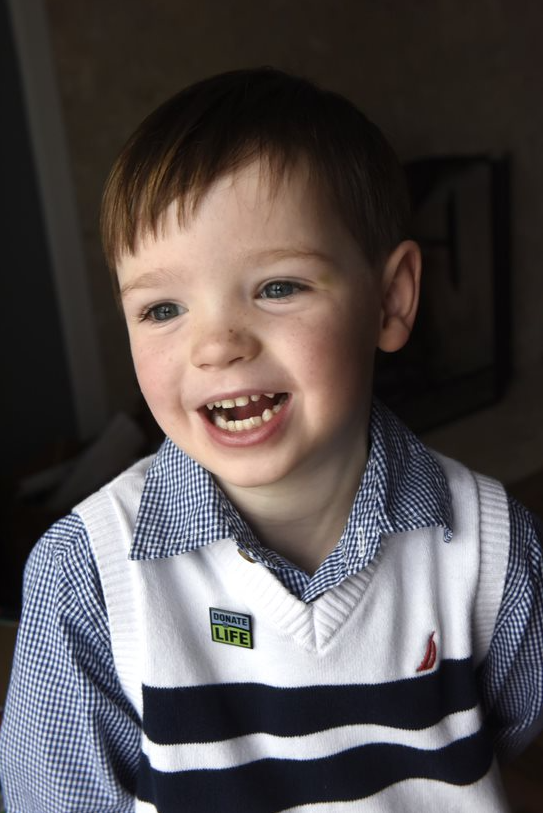 Coleton Voss, age 4, wearing a Donate Life lapel pin on his sweater