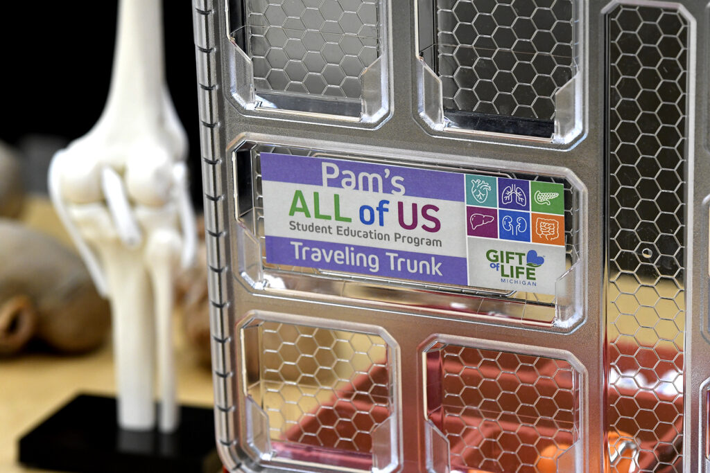 A close-up of Pam's All of Us Traveling Trunks