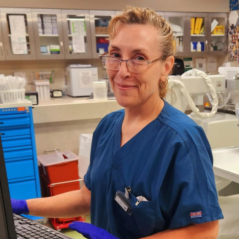 Cindy Zarate in blue scrubs in the ICU