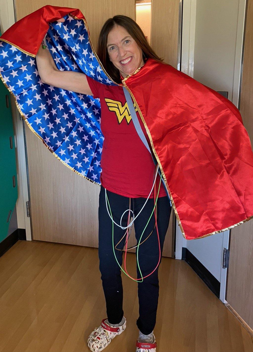 Sherry wearing a Wonder Woman t-shirt and cape