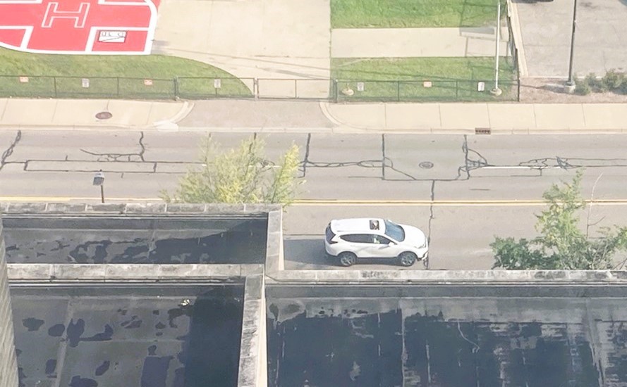 A white Honda CRV, as seen from the 7th floor of the hospital