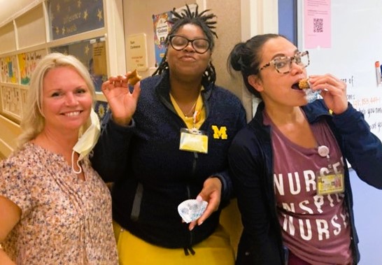 Hospital staff enjoying some cookies.