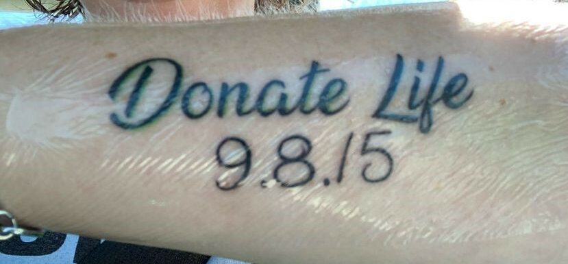 Tattoo reading "Donate Life" with the date 9-8-15