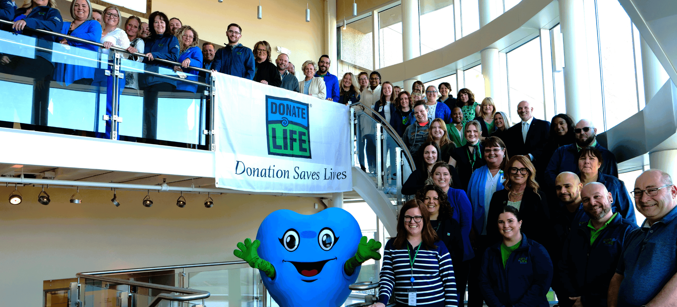 Gift of Life staff gathered on National Donate Life Blue & Green Day in April 2024