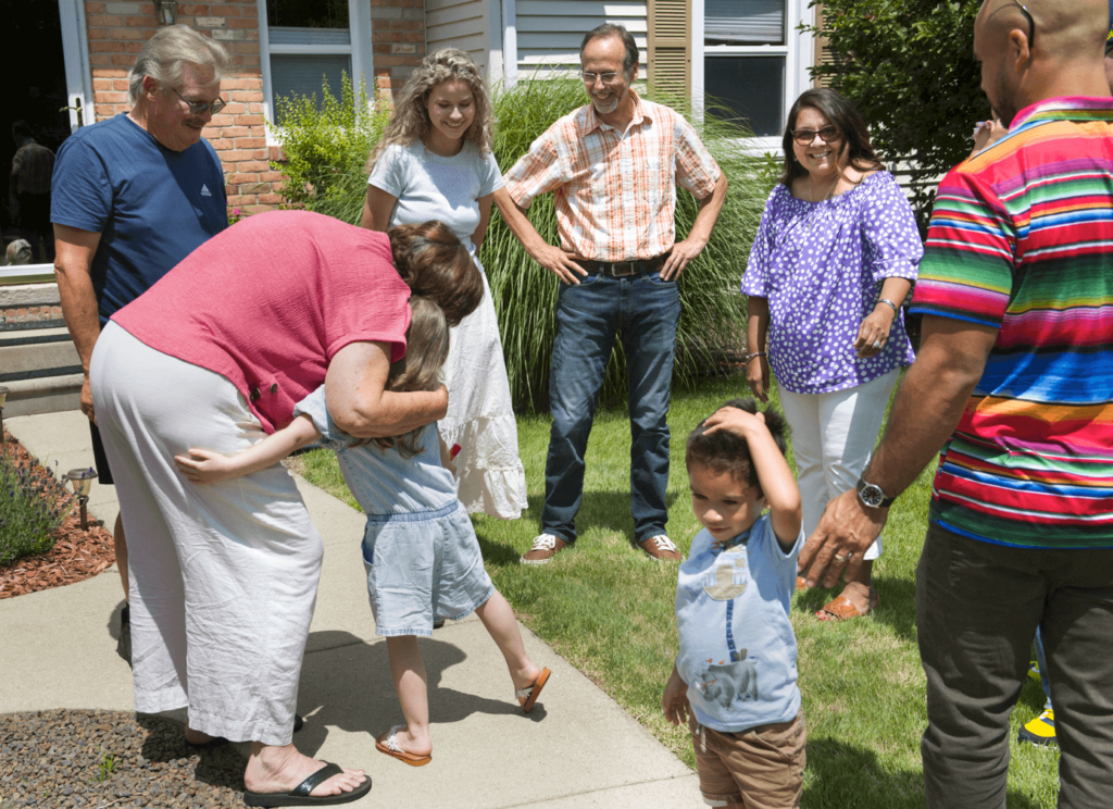 Carla and Gloria's families meeting Suzanne's family