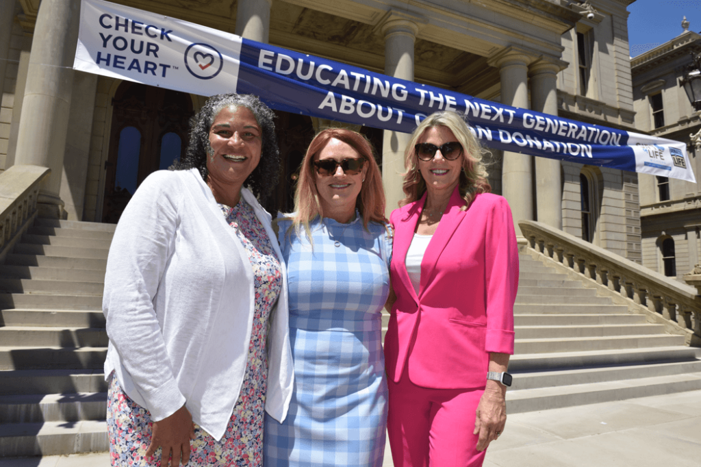 Left to right: State Rep. Felicia Brabec, Gift of Life Michigan’s president and CEO, Dorrie Dils, and Lansing news anchor Sheri Jones at the Check Your Heart Capitol Rally. 