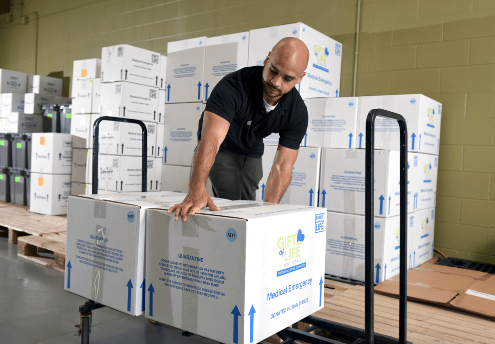 Dain Mendoza at work in the warehouse at Gift of Life. His mother received a lung transplant in 2020.