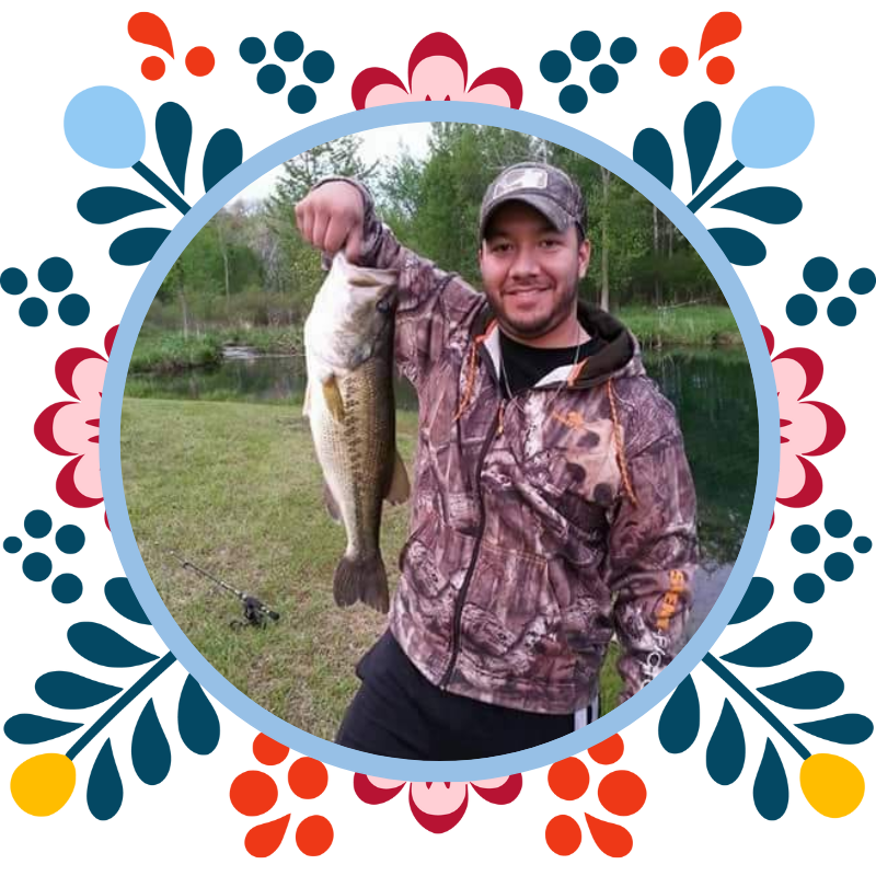 Travis Ybarra holding a fish he caught