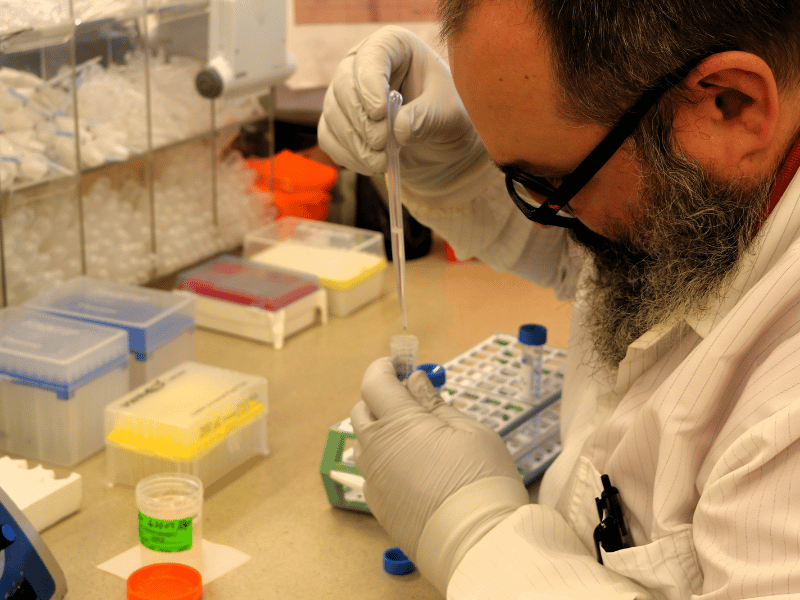 Paul McKenna using a pipette in the laboratory