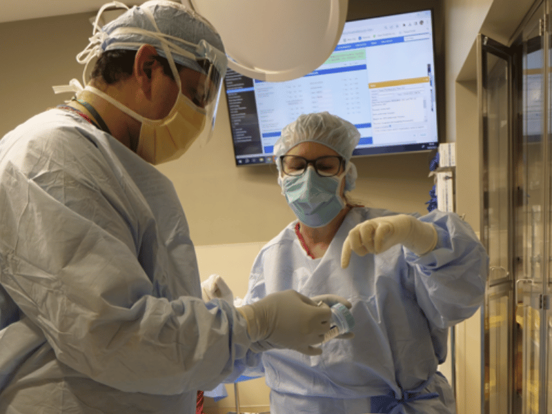 Preceptor training new staff member in the operating room