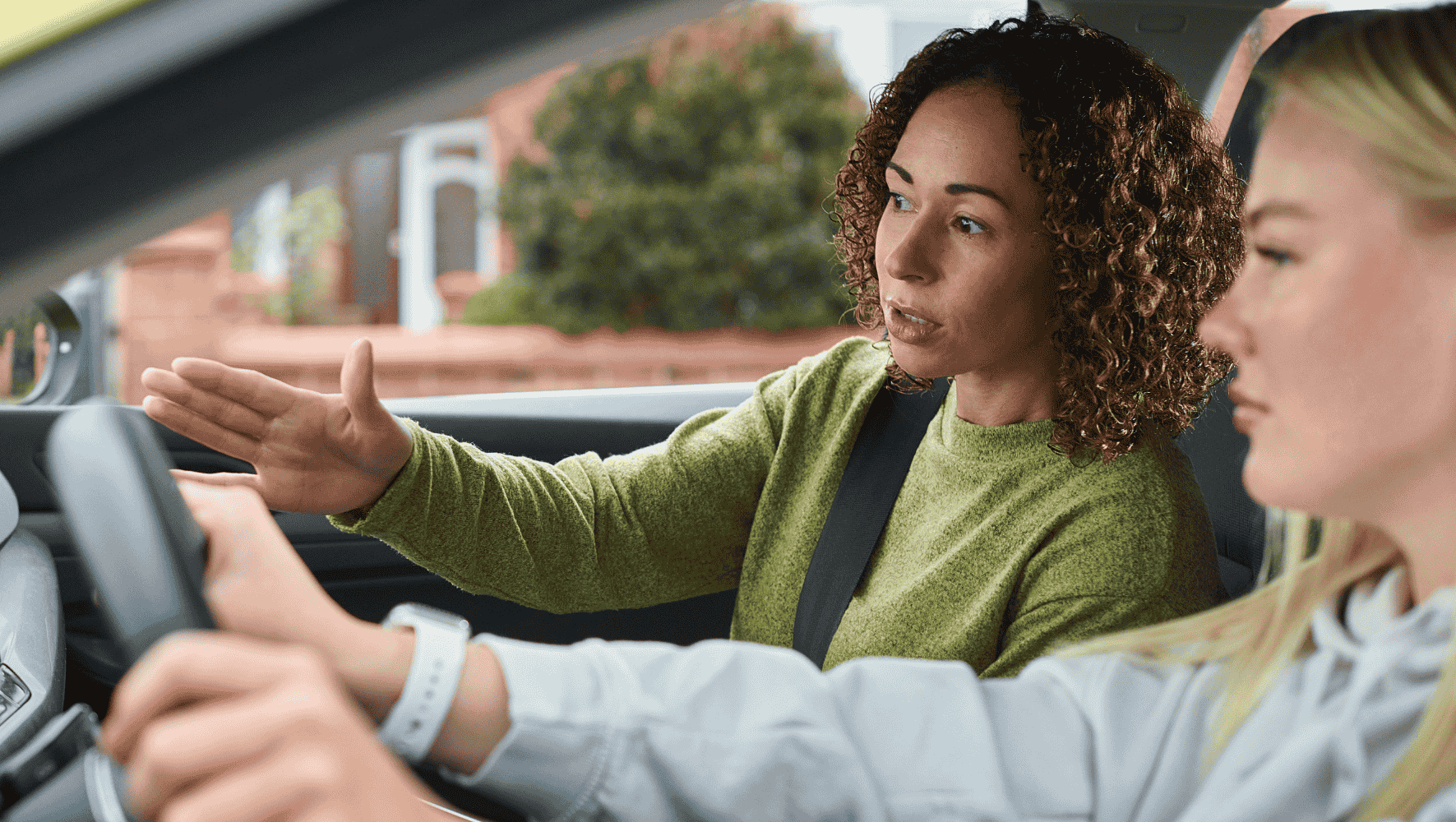 driver ed instructor coaching student driver