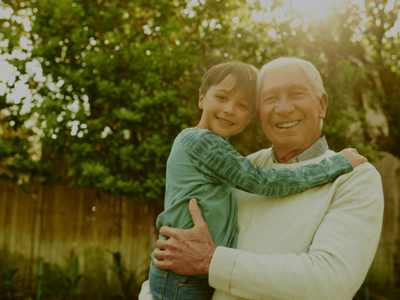 Grandfather holding his young grandson