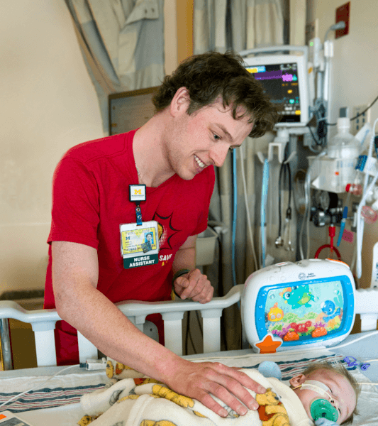 His time as a nurse assistant at Mott helping pediatric heart patients is a full-circle experience for Tommy.