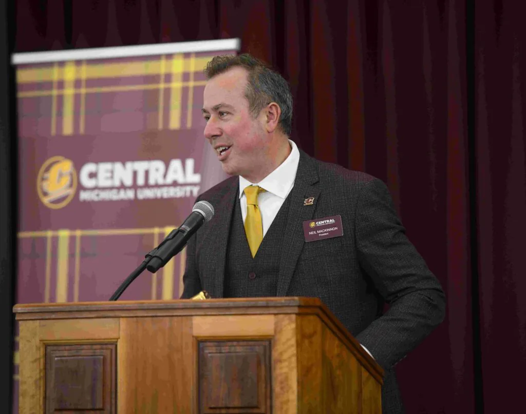 CMU president at the podium