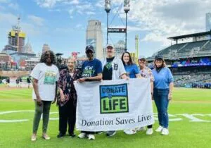 Gift of Life Michigan President and CEO Dorrie Dils with other supporters of organ, eye and tissue donation on the field at Comerica Park